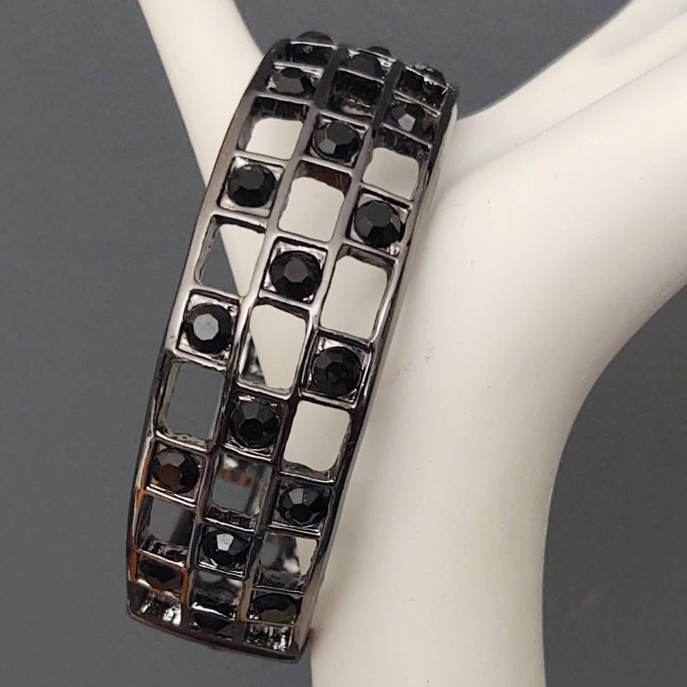 Dark gray metal bracelet with black bead accents